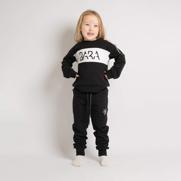 Sweatpants in black loose fit for kids unisex from Bara Sportswear